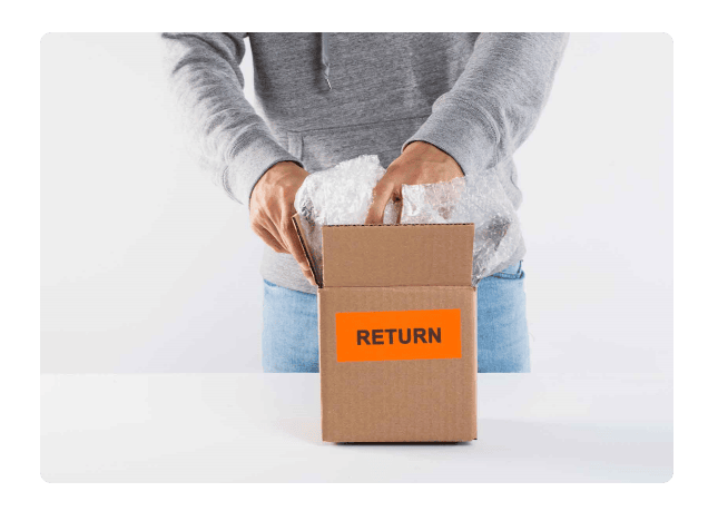 person holding a box with return label