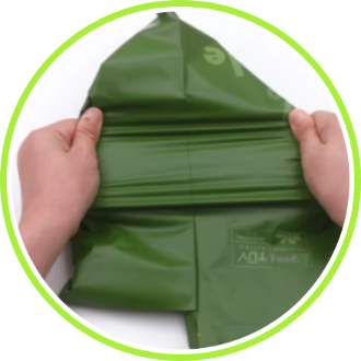 green_compostable_mailer_being_opened.