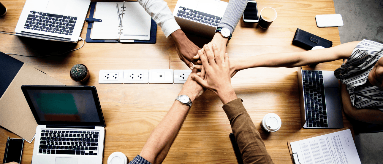 the_team_stacked_their_hands_and_cheered